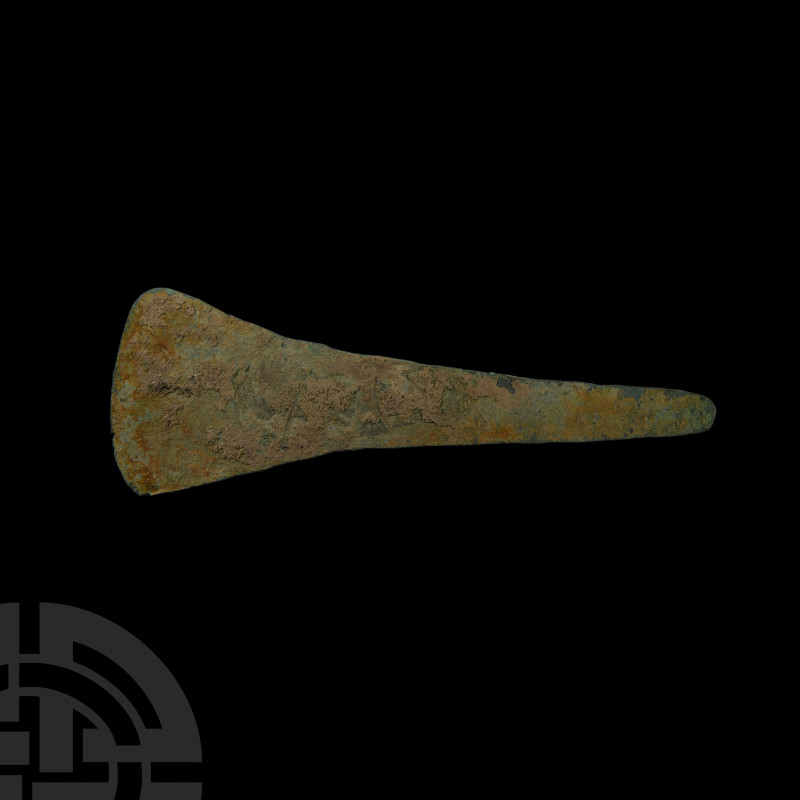 Luristan Copper Flat Axehead
13th-7th century B.C. Formed with a rounded butt a...