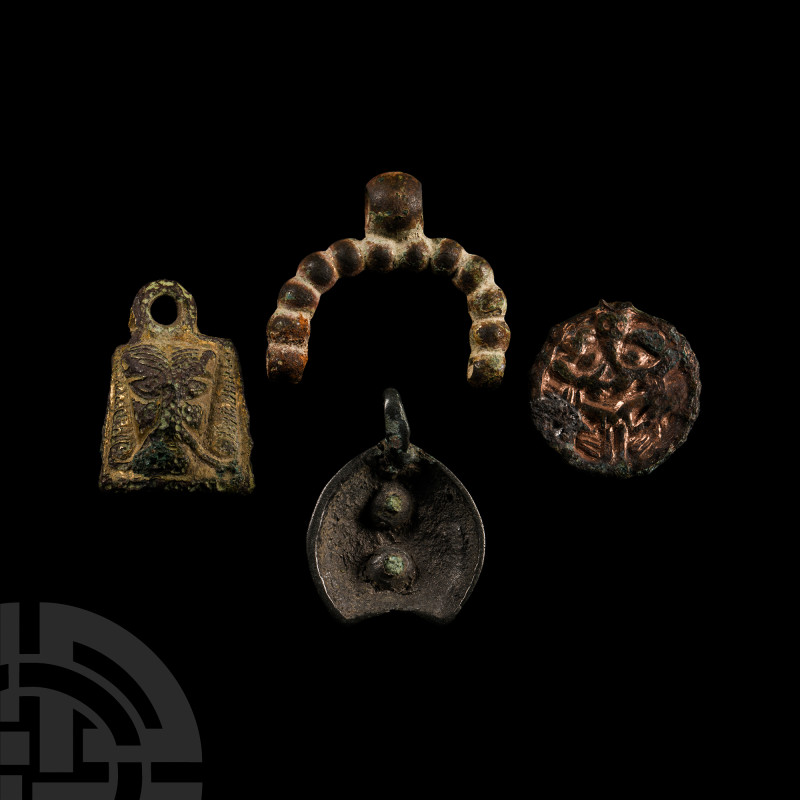 Viking Age Bronze Pendant Collection
9th-11th century A.D. Comprising: a lunar ...