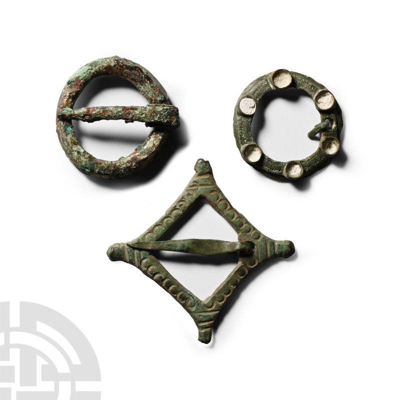 Medieval Bronze Ring Brooch Group
Circa 14th-16th century A.D. Comprising: a pl...