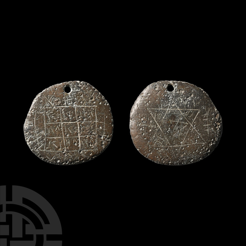 Medieval Bronze Pendant with Magical Symbols
Circa 14th-16th century A.D. The l...