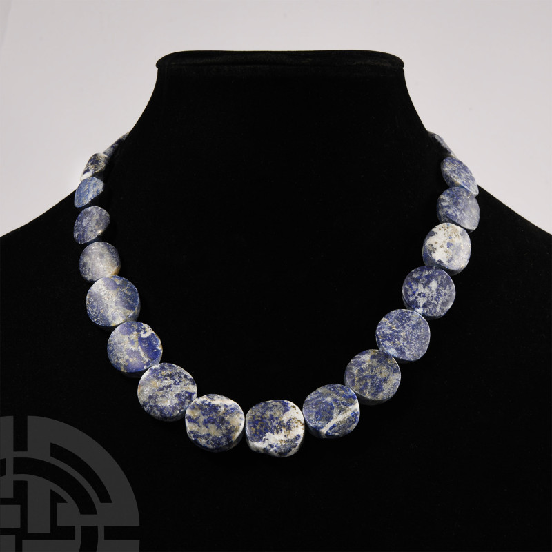 Sodalite Bead Necklace
20th century A.D. Composed of graduated coin-shaped bead...