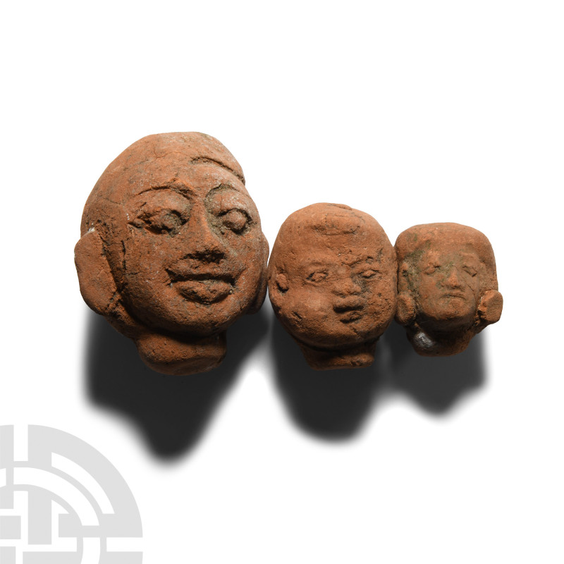 South East Asian Votive Terracotta Head Group
Circa 12th-14th century A.D. Comp...