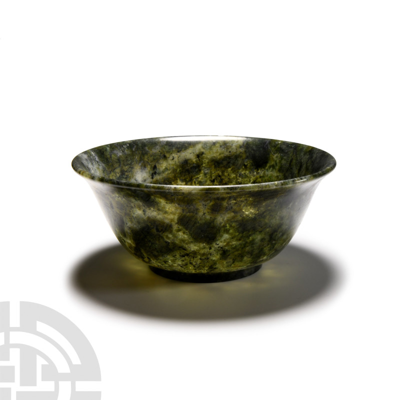 Chinese Mottled Green Jade Bowl
20th century A.D. Polished with hemispherical b...