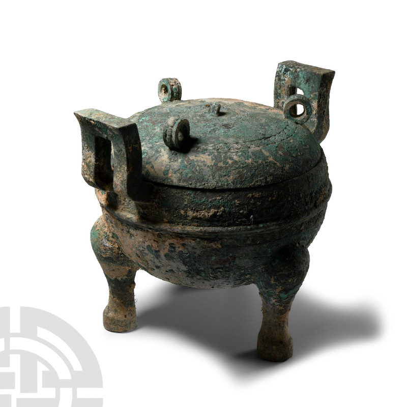 Chinese Archaic Style Bronze Lidded Vessel
20th century A.D. 'Ding' vessel with...