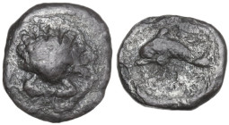 Greek Italy. Southern Apulia, Tarentum. AR 1/20 Stater, 325-280 BC. Obv. Scallop shell. Rev. Dolphin left. HN Italy 980; HGC 1 865. AR. 0.41 g. 8.50 m...