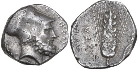 Greek Italy. Southern Lucania, Metapontum. AR Stater, 340-330 BC. Obv. Head of Leukippos right, wearing Corinthian helmet; behind, seated dog. Rev. Ea...