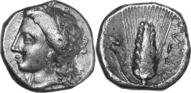 Greek Italy. Southern Lucania, Metapontum. AR Nomos, 330-290 BC. Obv. Head of Demeter left, wearing wreath of grain. Rev. Ear of barley; to left, grif...