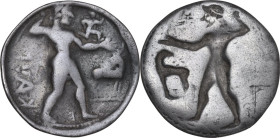 Greek Italy. Bruttium, Kaulonia. AR Stater, 525-500 BC. Obv. Apollo striding right, brandishing branch, on outstretched arm a small daimon running rig...