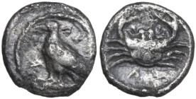 Sicily. Akragas. AR Litra, c. 450-440 BC. Obv. AK-PA (retrograde). Eagle standing left on Ionic capital. Rev. Crab; ΛI (mark of value) below. HGC 2 12...