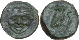 Sicily. Kamarina. AE Tetras, 425-405 BC. Obv. Gorgoneion. Rev. Owl standing right, head facing, wings closed, holding lizard; in exergue, three pellet...