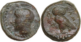 Sicily. Kamarina. AE Tetras, 425-405 BC. Obv. Head of Athena left, wearing helmet decorated with wing. Rev. Owl standing left, head facing, wings clos...