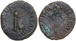 Nero (54-68). AE Quadrans, Rome mint. Obv. NERO CLAVD CAESAR AVG. Column, upon which rests a crested helmet, spear behind, round shield leaning agains...