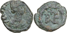 Ostrogothic Italy, Theoderic (493-526). AE Decanummium, Rome mint, 512-522. Obv. Turreted and draped bust of Felix Ravenna right. Rev. Monogram within...