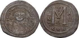 Justinian I (527-565). AE Follis, Constantinople mint. Dated RY 13 (539-540). Obv. Helmeted and cuirassed bust facing, holding globus cruciger and shi...