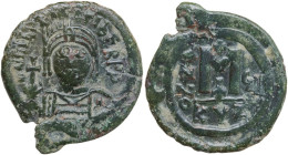 Maurice Tiberius (582-602). AE Follis, Cyzicus mint, dated RY 8 (589-590). Obv. Helmeted and cuirassed bust facing, holding globus cruciger and shield...