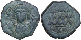 Phocas (602-610). AE Follis, Nicomedia mint, dated RY 6 (607-608). Obv. Consular bust facing, holding mappa and cross. Rev. XXXX (mark of value). MIB ...