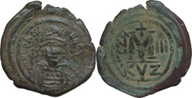 Heraclius (610-641). AE Follis, Cyzicus mint, darted RY 3 (612-613). Obv. Helmeted, diademed and cuirassed bust facing, holding cross and shield. Rev....