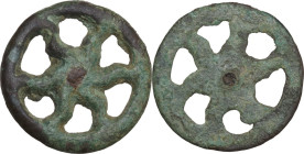 ITALIC VOTIVE ELEMENTItalic eastern culture, c. 7th century BC. Votive bronze element in the shape of a six rayed sun. 3.69 g. 23.50 mm. Interesting i...