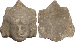 MAGNA GRECIAN TERRACOTTA APPLIQUE Magna Graecia, c. 4th-2nd century BC. Terracotta applique made from matrica, depicting a female head, probably a the...