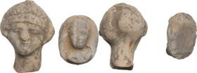 MAGNA GRECIAN TERRACOTTA HEADS Magna Graecia, c. 4th-2nd century BC. Lot of two (2) female terracotta heads, one worked in the round, the other restin...