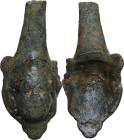 VASE HANDLE ATTACHMENT Roman period, c. 1st-3rd century AD. Terminal part of Roman bronze vase handle. Pleasant relief decoration with a young man's h...
