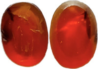 ROMAN CARNELIAN INTAGLIO Roman period, c. 1st-3rd century AD. Carnelian intaglio with the engraved representation of a standing male figure holding a ...