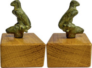 ROMAN ZOOMORPH FIGURINE Roman period, c. 1st-3rd century AD. Roman bronze figurine on wood block (modern addition) depicting an eagle standing on head...