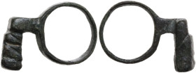 ROMAN BRONZE KEY-RING Roman Period, c. 1st - 3rd century AD. Bronze key-ring. Dimensions: 30 x 20 mm. Inner size: 18 mm. AE. Intact and complete.