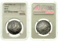 Römisch Deutsches Reich Haus Habsburg Maria Theresia, 1740-1780
1/2 Taler 1743 Prag. Var. mit breitem Wappen. Im NGC-Blister mit Grading MS 62 (fälsc...
