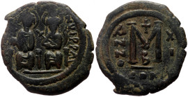 Justin II (565-578) AE Follis (Bronze, 12.23g, 30mm) Constantinople, 575/576 
Obv: Justin II, on left, and Sophia, on right, seated facing on double t...
