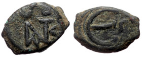 Justin II (565-578) AE Pentanummium (Bronze, 1.65g, 14mm) Nikomedia 
Obv: Monogram of Justin II 
Rev: Large E; Γ in right field.
Ref: Sear 363