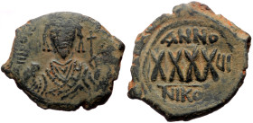 Phocas (602-610) AE Follis (Bronze, 13.85g, 33mm) Nicomedia. 
Obv: δ N FOCAS PER AVς (or similar) Crowned bust of Phocas facing, wearing consular robe...