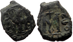 Constans II (641-668 AD) Constantinople AE Follis 
Obv: EN T૪TO NIKA, Constans II standing facing, wearing crown surmounted by cross , holding long cr...