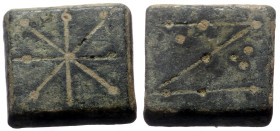 Roman-Byzantine Weight, 5th-6th century. AE 1 Nomisma (Bronze, 13mm Square, 4.37 g. 
Obv: Punch-engraved N; ring of pellets to upper right, four pelle...