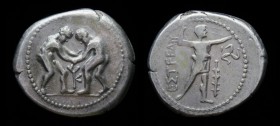 PAMPHYLIA, Aspendos, c. 330-250 BCE, AR Stater. 10.52g, 25mm.
Obv: Two wrestlers grappling; monogram between.
Rev: Slinger standing right; to right,...