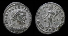 Diocletian (284-305), AE Follis, issued 303-305. Trier, 10.13g, 28.5mm.
Obv: Laureate and cuirassed bust right.
Rev: Genius standing left, holding pat...