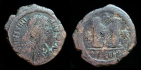 Justinian I (527-565), AE Follis, issued 533-537 AD. Theoupolis (Antioch), 6.8g, 30mm.
Obv: DN IVSTINI-ANVS PP AVG; Diademed, draped, and cuirassed bu...