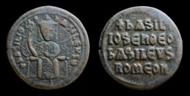 Basil I The Macedonian (867-886), AE Follis. Constantinople, 8.27g, 27.5mm.
Obv: + BASILIOS bASILEVS ✱; Crowned figure of Basil enthroned facing, wear...
