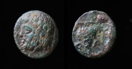 AEOLIS, Temnos, 4th-3rd c. BCE, AE10. 10mm. 
Obv: Bearded, laureate head of Dionysos left. 
Rev: T-A T-A to left and right of bunch of grapes on vine ...