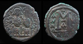 Justin II (565-578), AE Follis, issued 573/4. Nikomedia, 12.77g, 28.5mm.
Obv: DN IVSTINVS PP AVG; Justin II and Sophia seated facing.
Rev: Large M; cr...