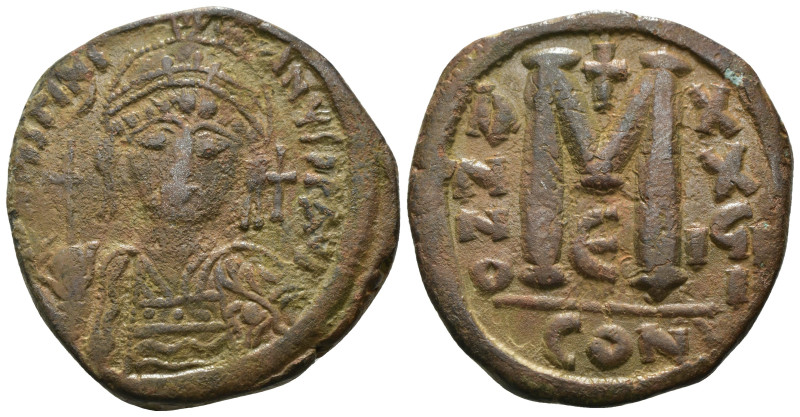 Justinian I. (527-565 AD) Æ Follis. Constantinople. Obv: crowned bust facing hol...