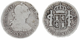 Moneda virreinal. Carlos III. 2 Reales. 1785. M.I (Manuel Iglesia Abarca e Ignacio Zenón Gálvez) . Lima. Anv: Busto de Carlos III mirando hacia la der...
