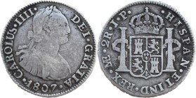 Moneda virreinal. Carlos IV. 2 Reales. 1807. J.P (Juan Martínez de Rosas y Pablo Cano Melgarejo). Lima. Anv: Busto de Carlos IV mirando hacia la derec...