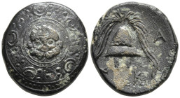 KINGS OF MACEDON, Philip III Arrhidaios (Circa 323-317 BC) AE Obv: Macedonian shield, with facing gorgoneion on boss. 4.17g.17.8mm Rev: A. Helmet; M t...