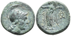 Aeolis. Aigai 200-50 BC. Bronze Æ 15mm. Helmeted head of Athena right / Nike advancing left, holding wreath and palm frond, monograms to left and righ...