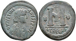 Justinian I Æ Nummus. Theoupolis (Antioch), AD 533-537. D N IVSTINIANVS P P AVG, pearl-diademed, draped, and cuirassed bust right / Large M; cross abo...