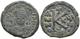 Justinian I. Æ Half Follis AD 527-565. Cyzicus mint. Dated RY 18 (544/5). Helmeted and cuirassed bust facing, holding globus cruciger and shield; cros...