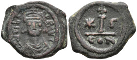 Maurice Tiberius. AD 582-602. Æ DecanummiumConstantinople mint, 3rd officina. Crowned, draped, and cuirassed bust facing / Large I; cross above, star ...