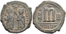 Phocas Æ 40 Nummi. Theoupolis (Antioch), dated RY 2 = AD 603/4. ∂ N FOCA NЄ PЄ AV, Phocas and Leontia standing facing, holding globus cruciger and cru...