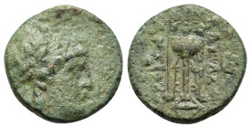 Seleukid Kings. Antiochos II Theos (261-246). Æ (16,7mm, 3.4g). Sardes. Laureate head of Apollo r. R/ Tripod. Monogram to outer l. and r.; below, anch...